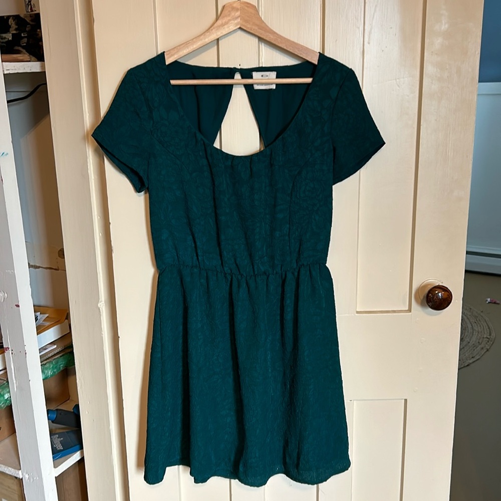 Holiday green “pins & needles” open back dress